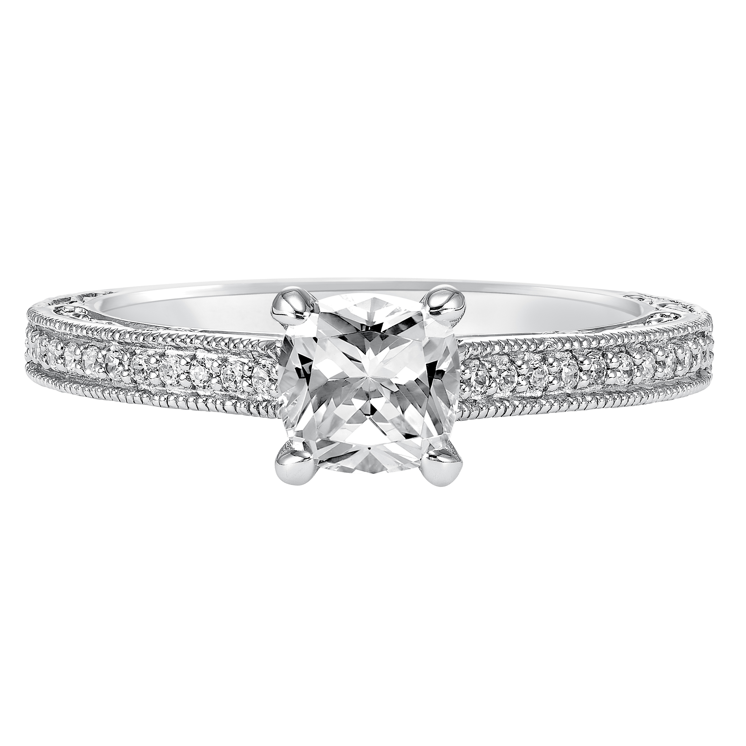 This charming cushion cut engagement ring features an exquisite prong set diamond band enhanced with milgrain and intricate filigree
