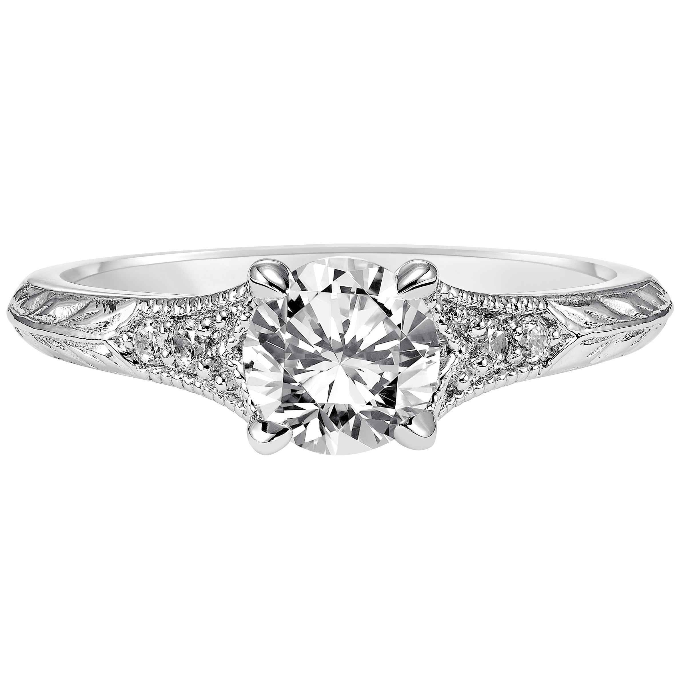 Modern heirloom style inspired the design of this engagement ring featuring a tapered diamond prong set band with milgrain and an engraved design