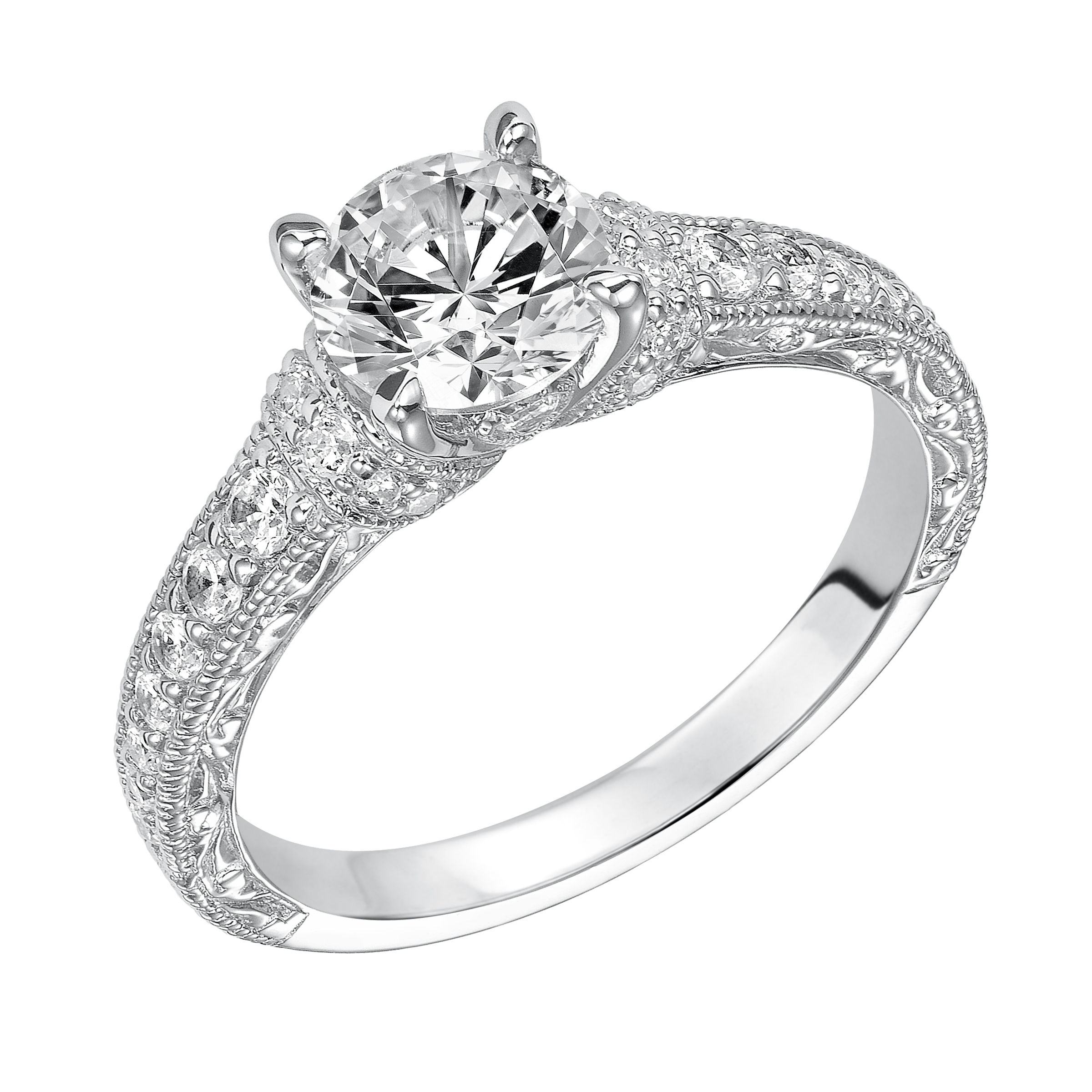 Intricately designed, this engagement ring is spectacular with its prong set diamond band, delicate engraving and milgrain