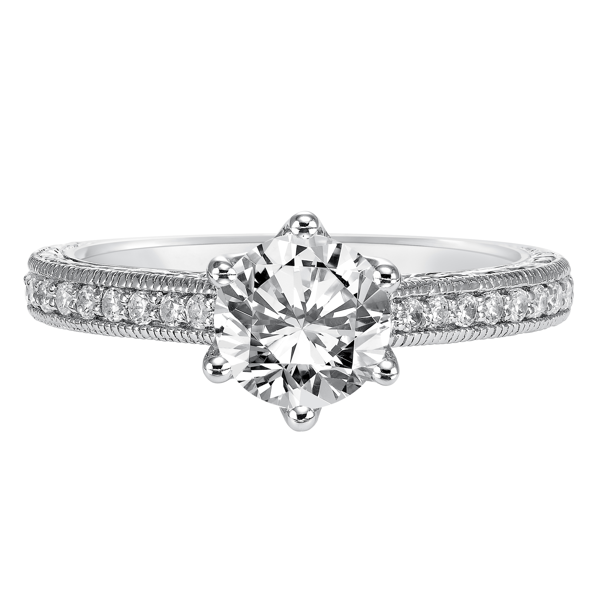Accentuated with a six prong setting, this round diamond engagement ring features a magnificent diamond prong set engraved band with milgrain