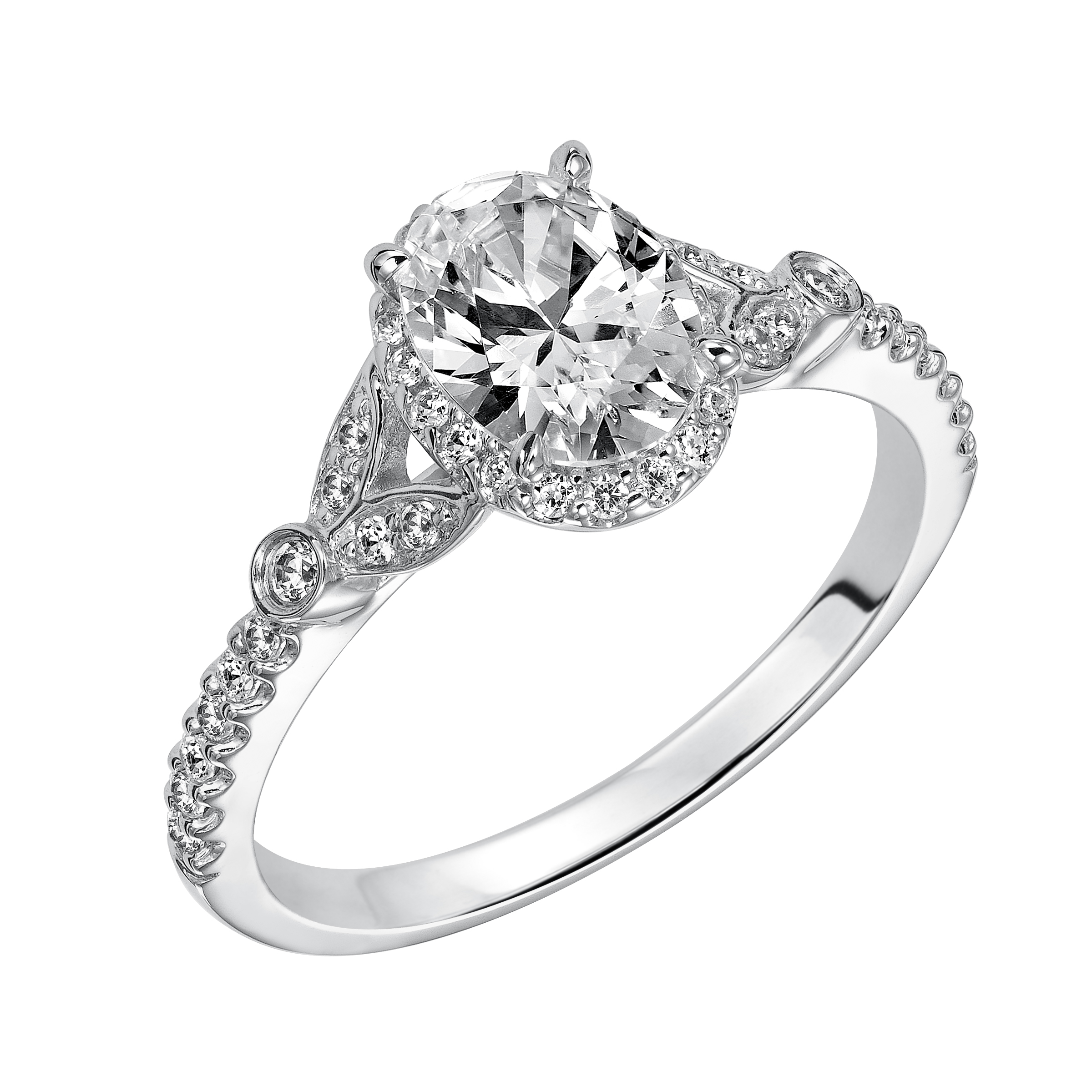 This romantic and beautiful engagement ring features an oval cut diamond accentuated by a prong set diamond halo and petal-inspired band design