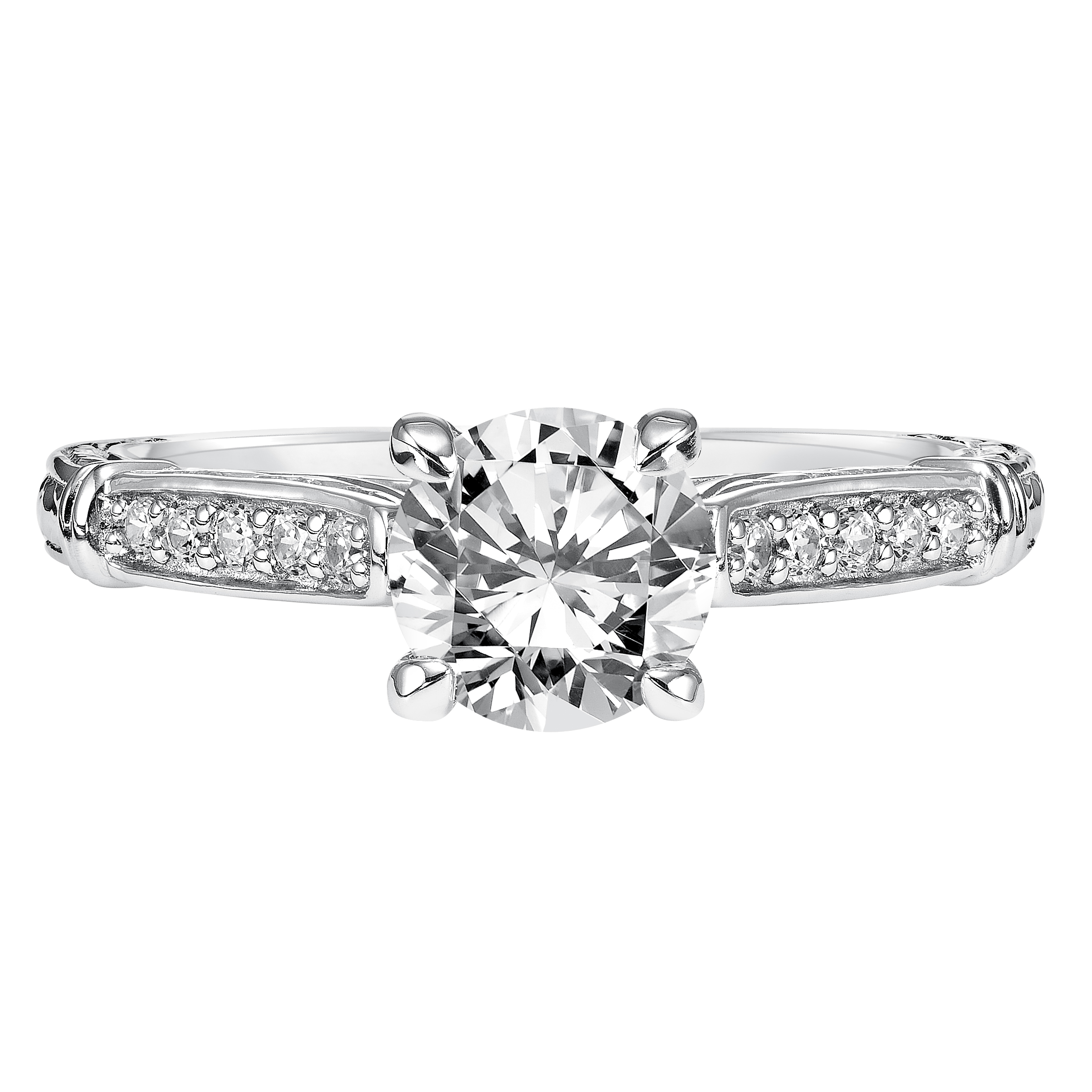 This brilliant round diamond is beautifully paired with this prong set diamond band enhanced with engraving