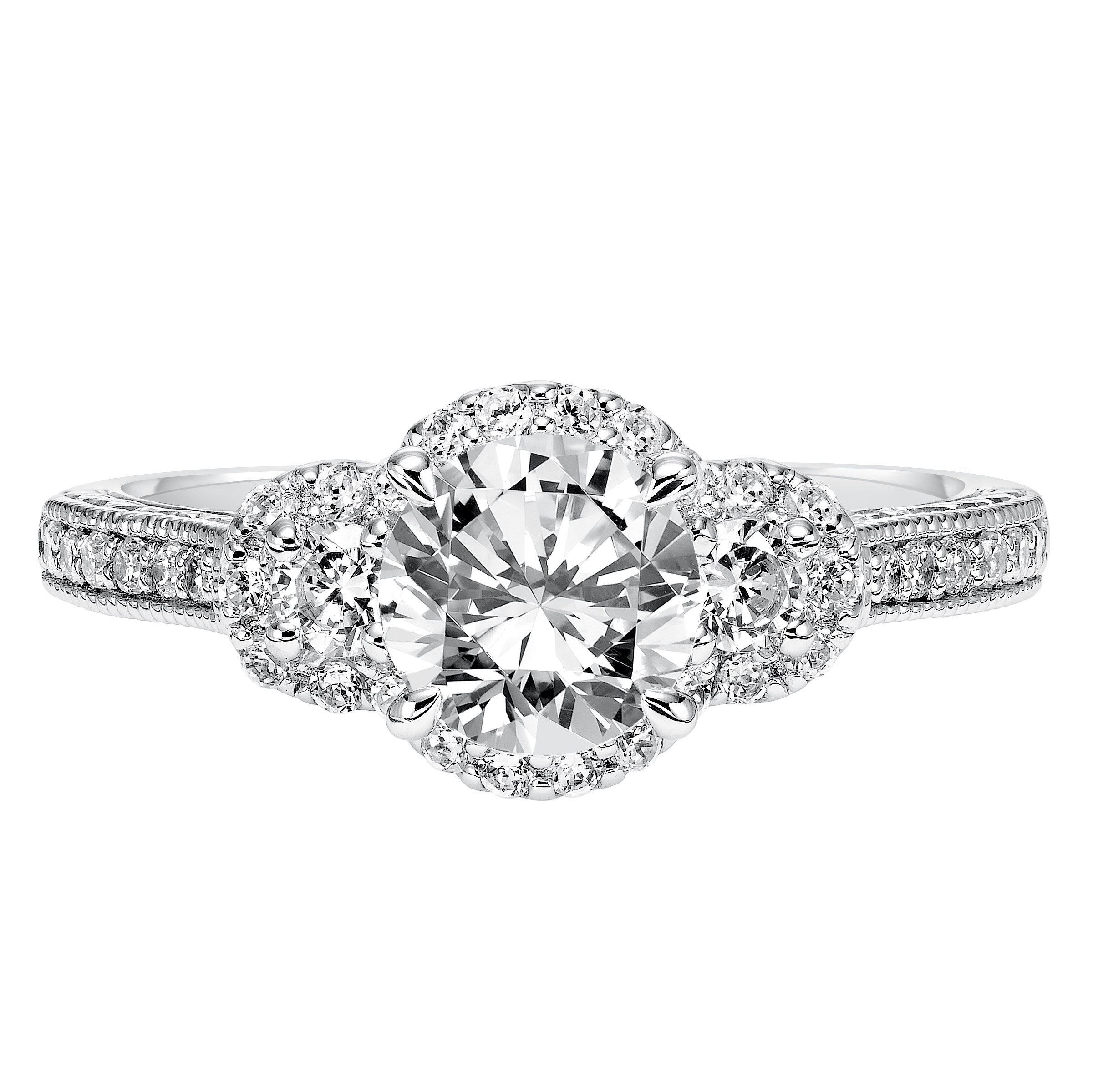 Bold, beautiful and timeless, this prong set diamond band with milgrain and engraving graces the band of this 3-stone diamond halo engagement ring