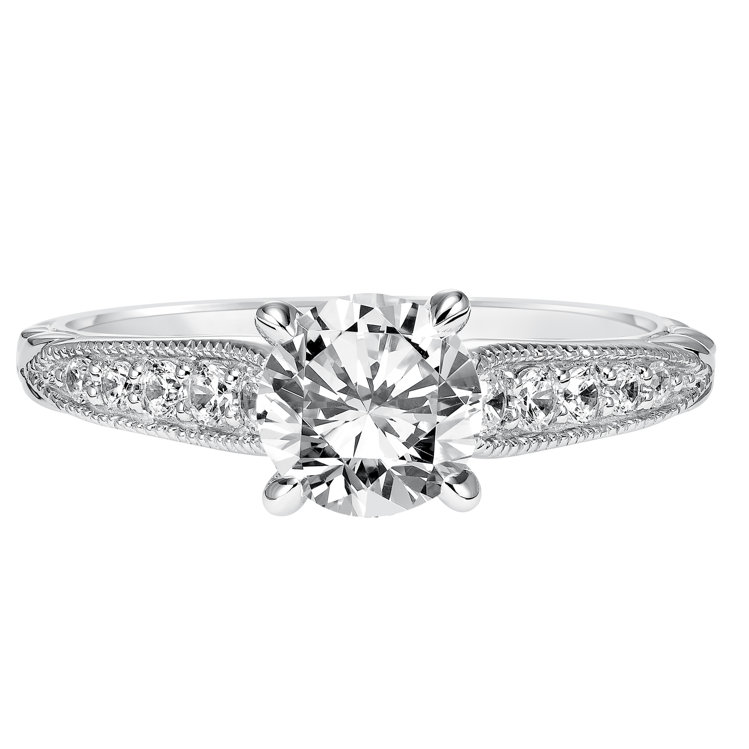 This charming diamond engagement ring features beautiful a diamond prong set band with milgrain details and an engraved design