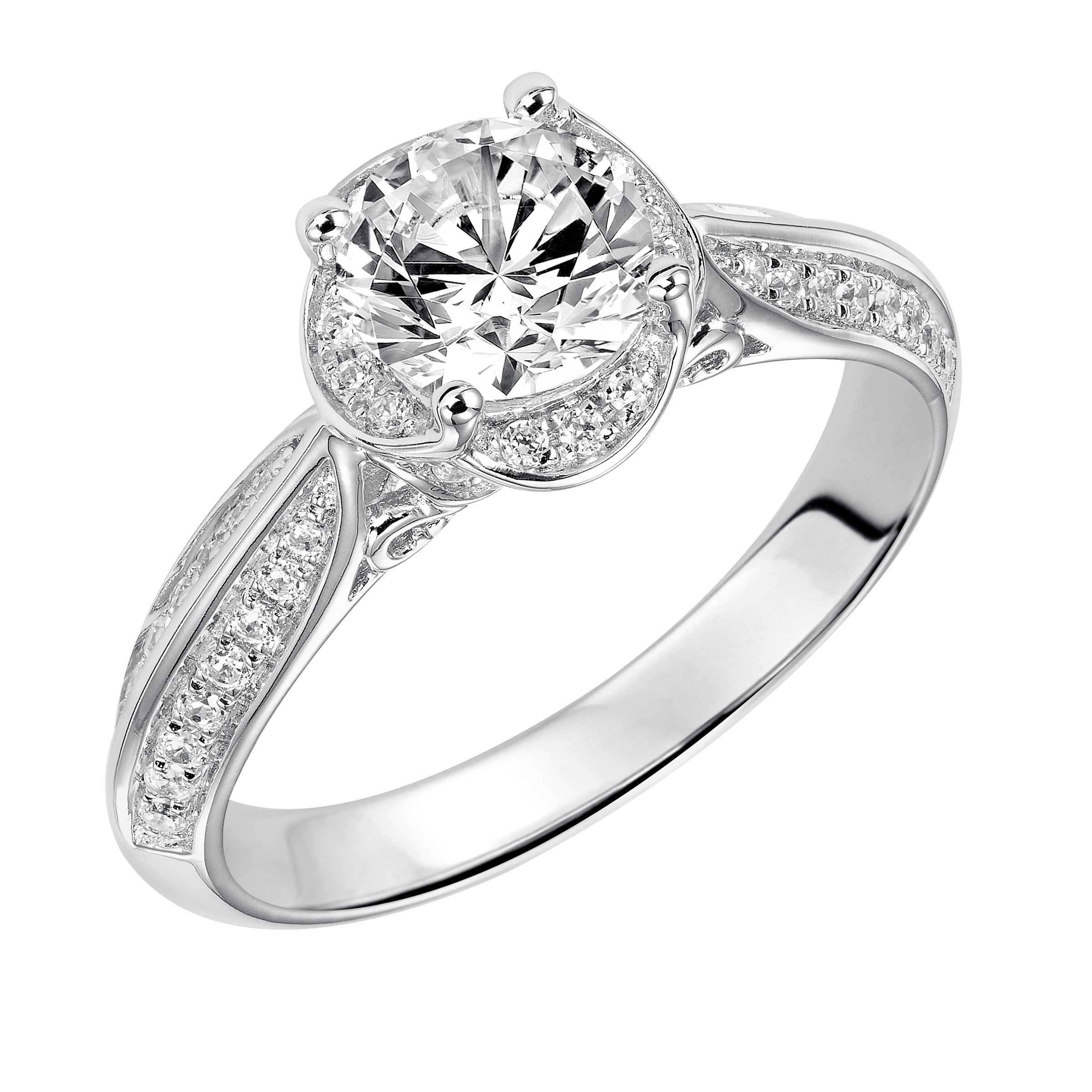 Alluring and romantic, this diamond engagement ring is lovely with its prong set diamond and filigree design details