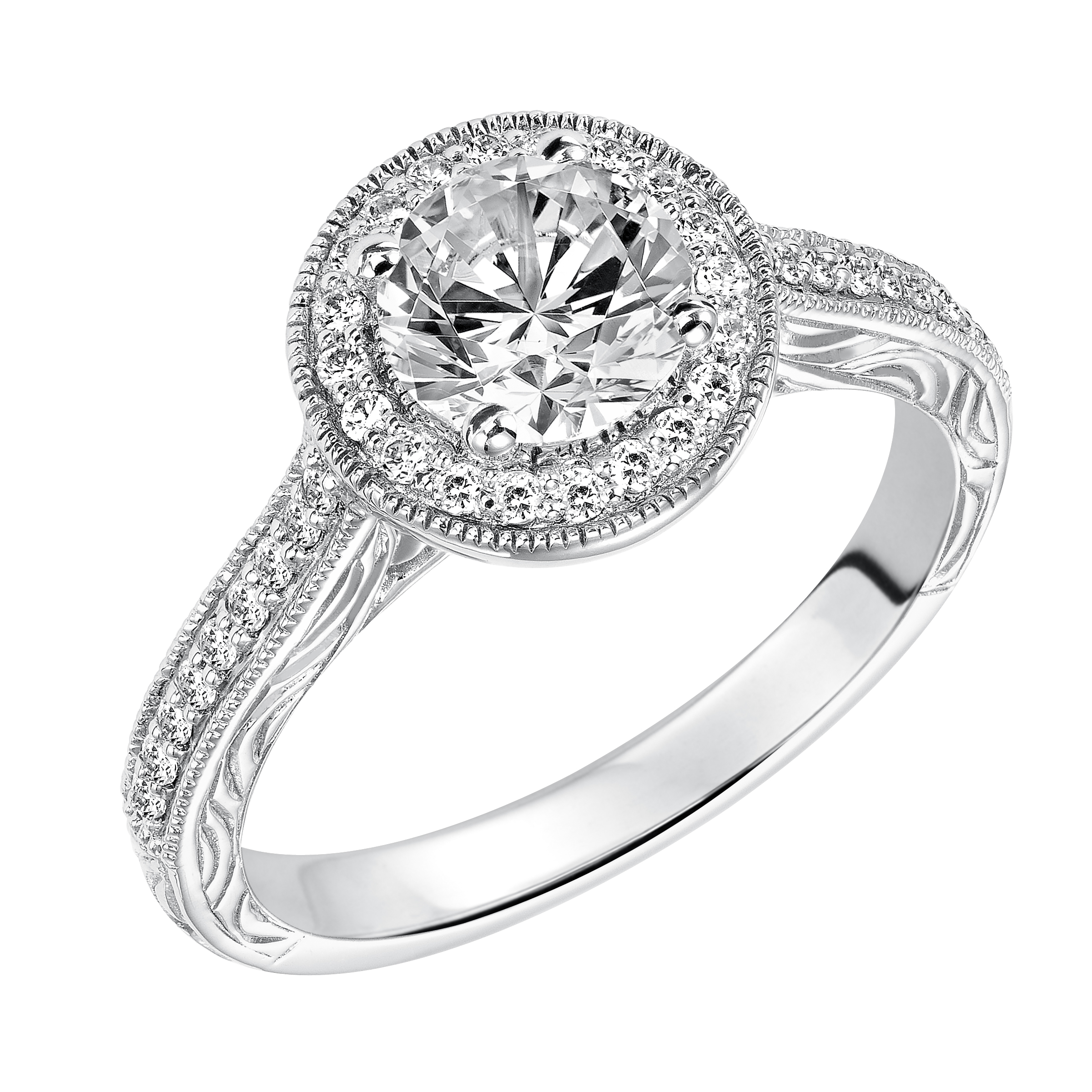 This captivating vintage inspired diamond halo engagement ring features a diamond and milgrain band with a delicate engraved design to complete to the look