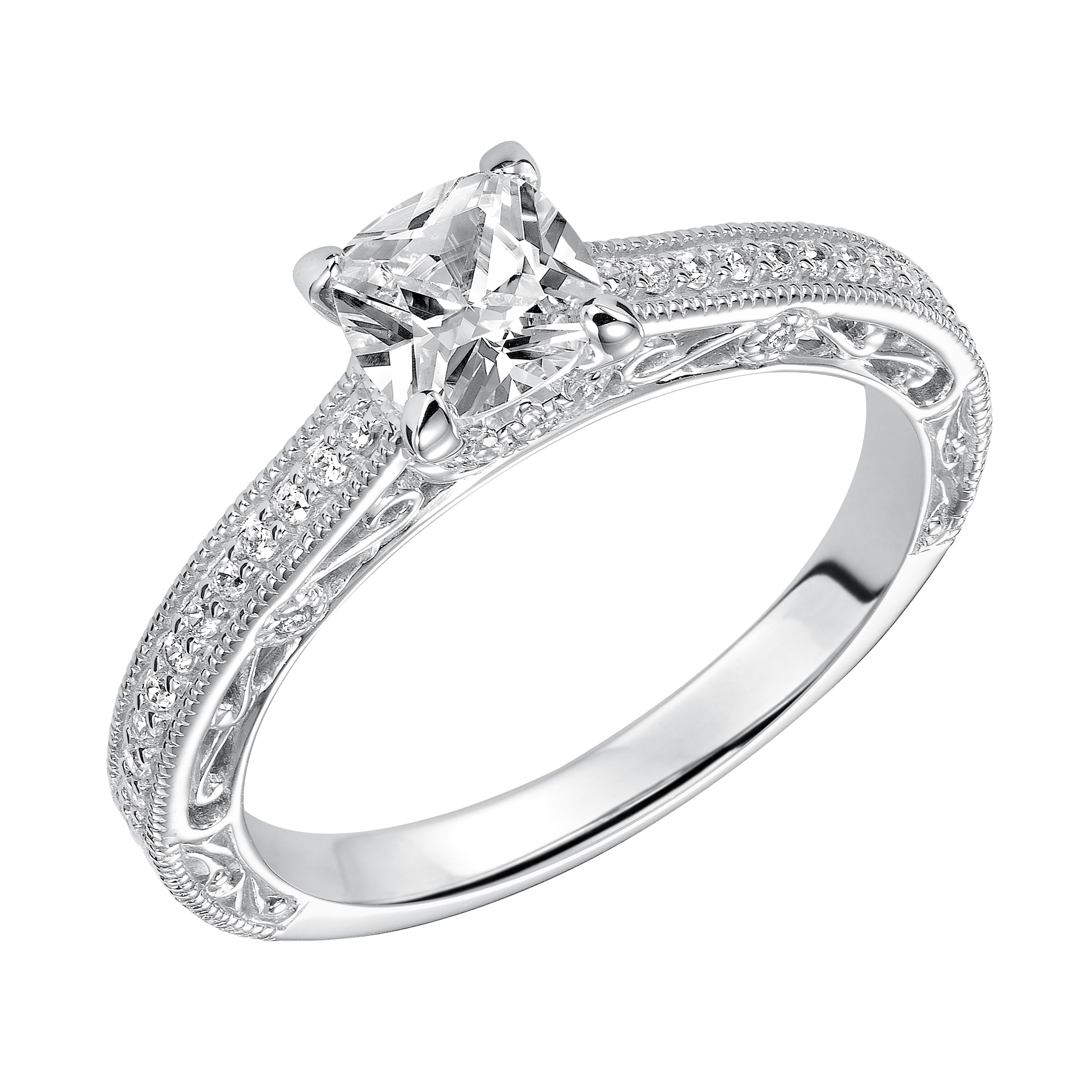 This charming cushion cut engagement ring features an exquisite prong set diamond band enhanced with milgrain and intricate filigree