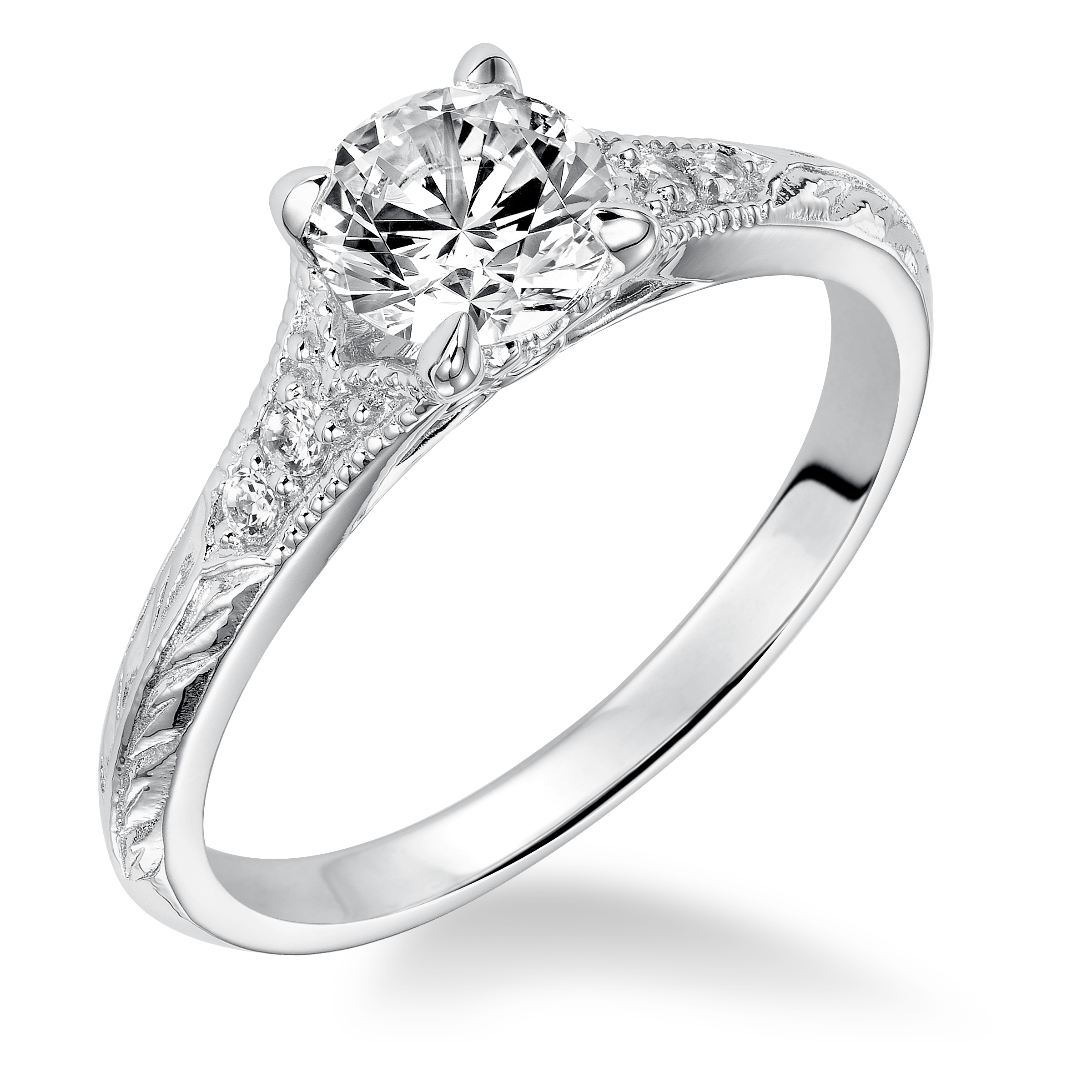 Modern heirloom style inspired the design of this engagement ring featuring a tapered diamond prong set band with milgrain and an engraved design