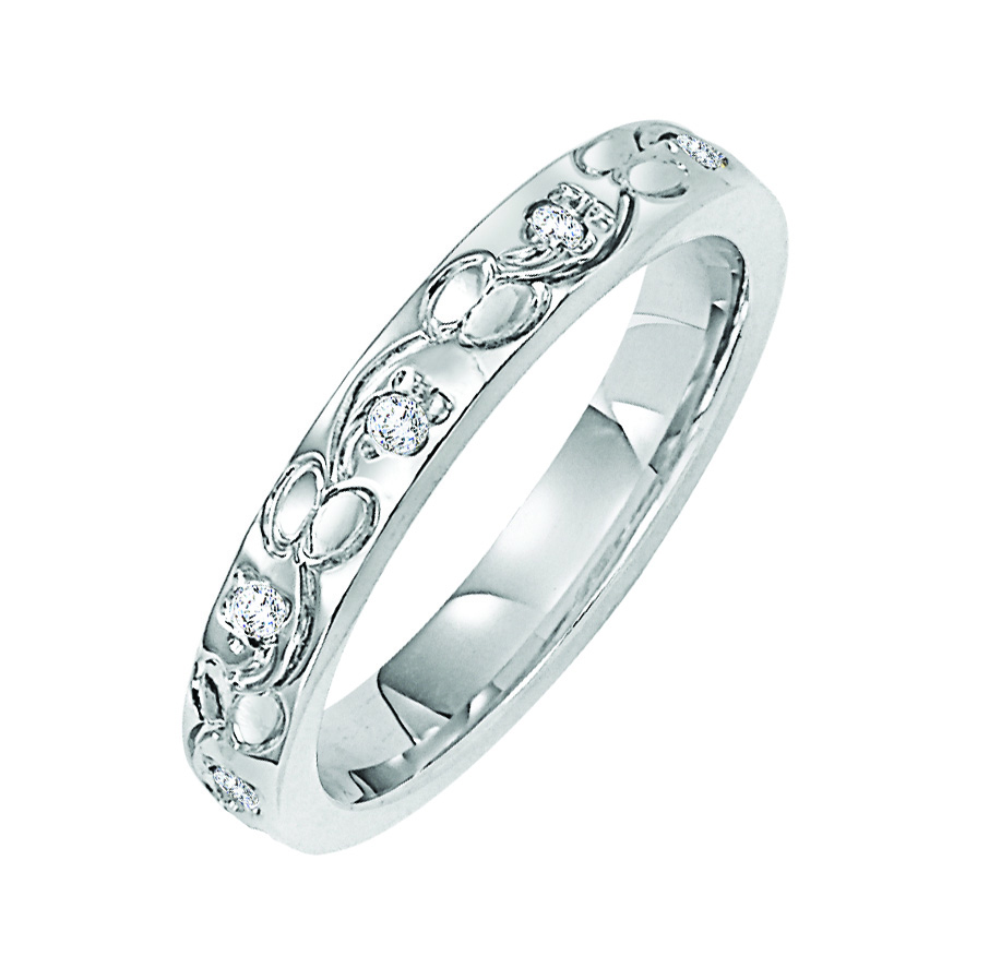 Wedding band with engraved design and diamond accents.